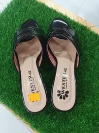 a pair of women's slip-on sandals or mules.