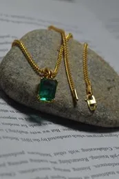 1.9mm fox singapore chain with green stone pendant.