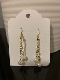 Golden Chain pearl earrings.