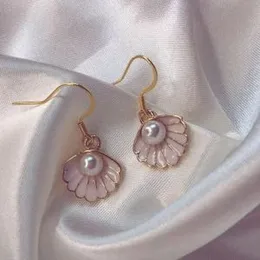 Shell pearl earrings.