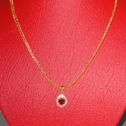 2.2mm fox chain with stone pendant.