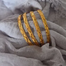 gold plated waves line bangles.