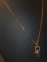 Elegant Gold Plated Infinity Pendant Necklace with Crystal Accents