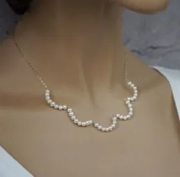 Simple white pearl necklace chain.