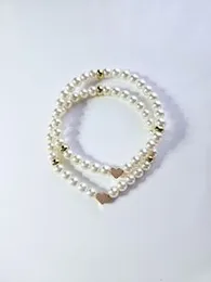 Heart charm gold couple bracelet .