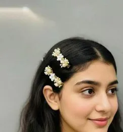 Woman wearing pearl and crystal floral-inspired hair clips 2Pcs Set