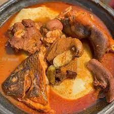 fufu with light soup cowmeat, intestine,wele,and fish
