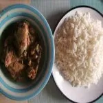 Goat light soup with plain rice