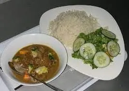 Plain rice and soup with goat