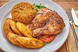 Jollof rice with grilled chicken and plantain