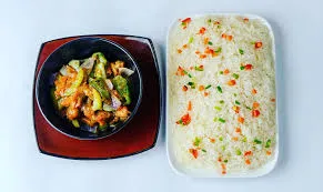 Plain rice with gravy, chicken, and coleslaw