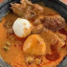 Fufu with Goat light soup and assorted meat [ intestines]