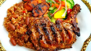 Jollof Rice with Grilled Chicken(plantain and salad