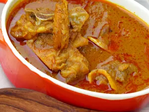 Banku with palm nut soup with cow feet