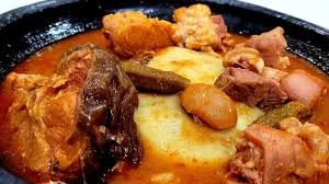 Fufu with palmnut soup and goat meat