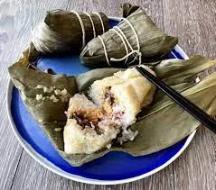 Chinese Sticky Rice Tamale With Peanuts And Salted Pork In Bamboo Leaf