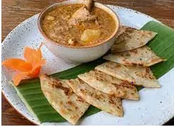 Roti Dipping With Massaman Curry